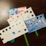 Ellis made the first 3 flags for us to wave. Elliot was dissatisfied with his sister's flag, so he made his own U.S.A. flag.